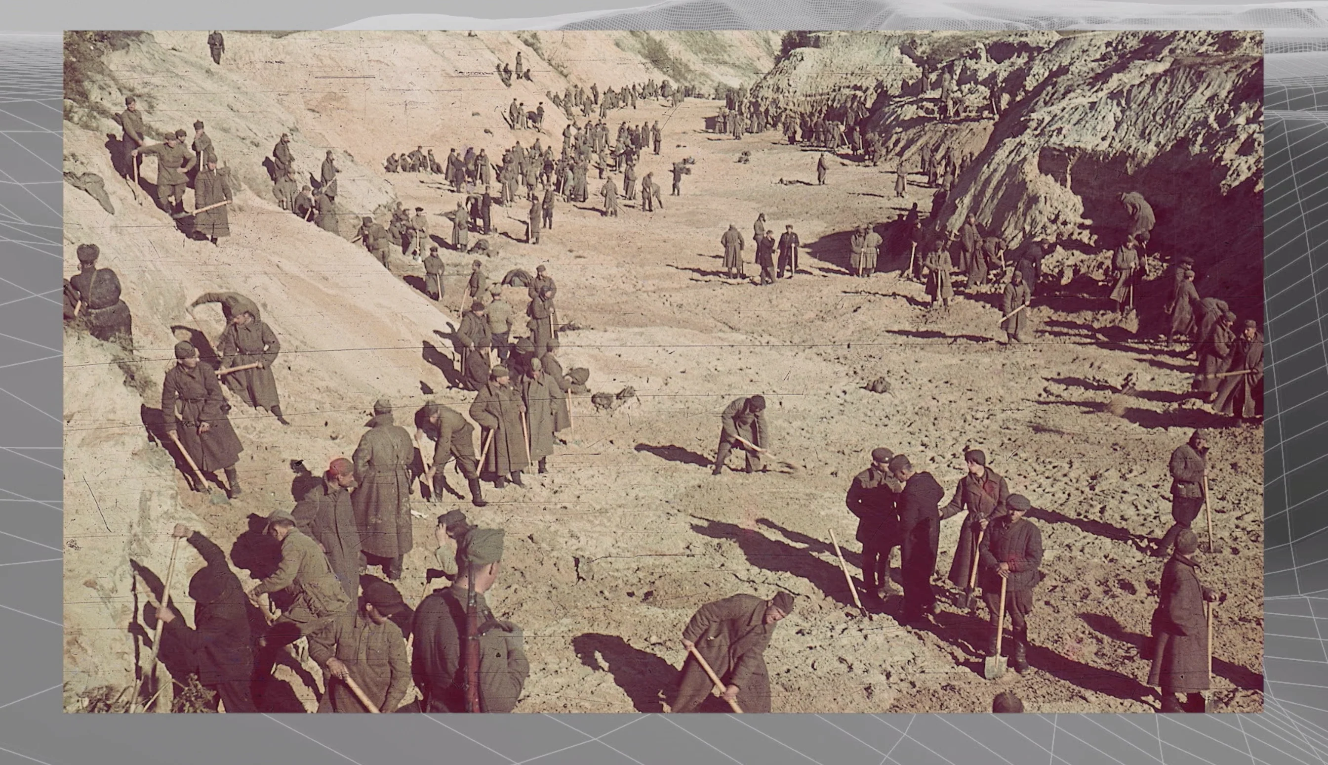 Figure XVIII. Location №3 on figure XV. A photograph captures Soviet prisoners of war covering victim bodies with earth from the ravine banks, resulting in changes to the topography. By Johannes Hähle, October 1 1941. CST for BYHMC.